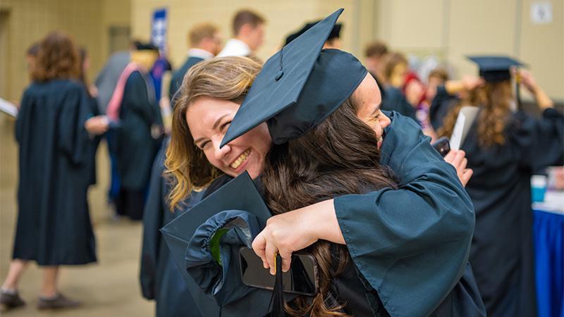 Students after graduation in their gowns.