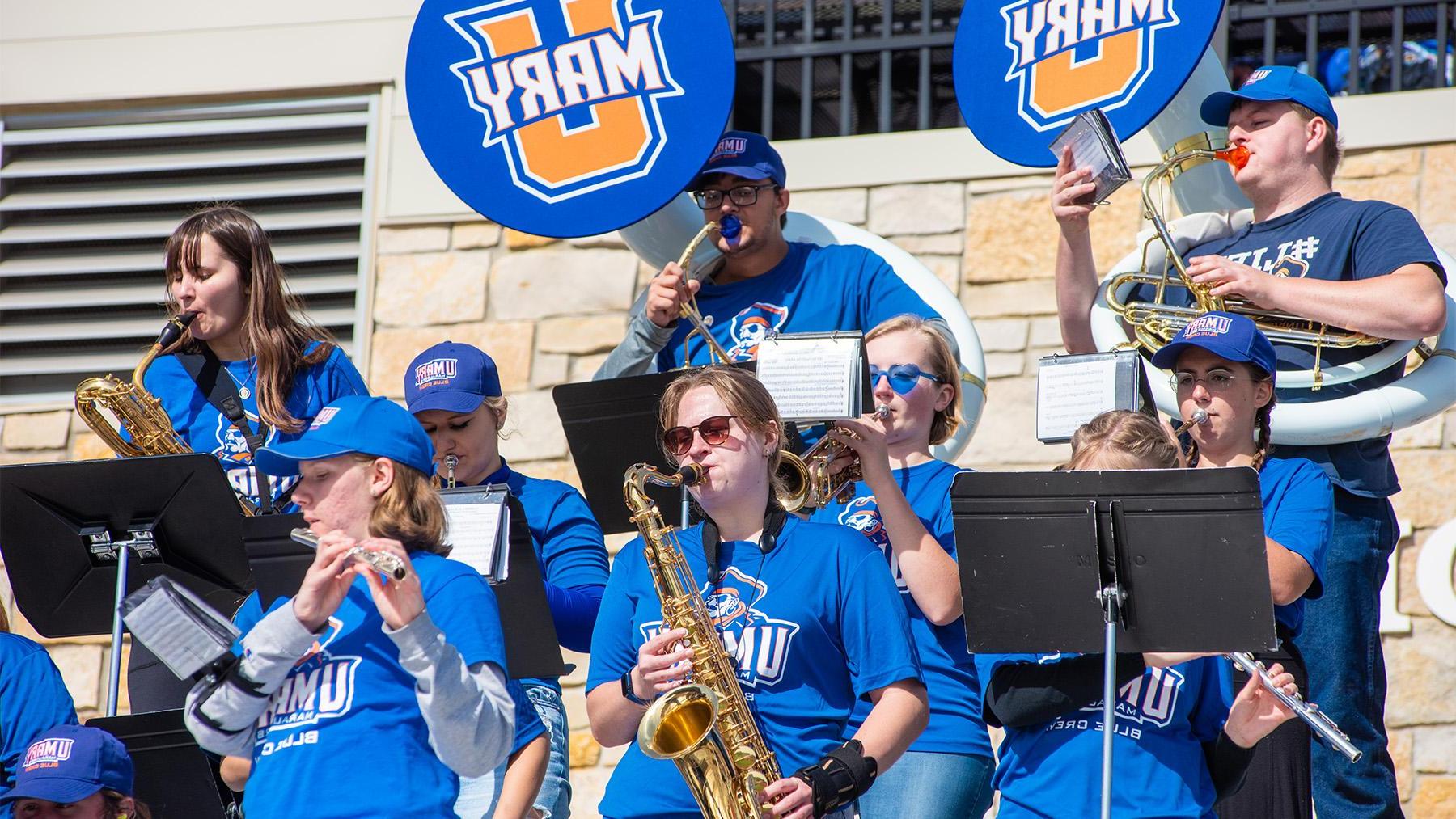 Pep band students at a football game